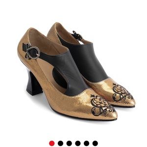 John Fluevog  Gold and Black. Limited style.. Poser: Darla.